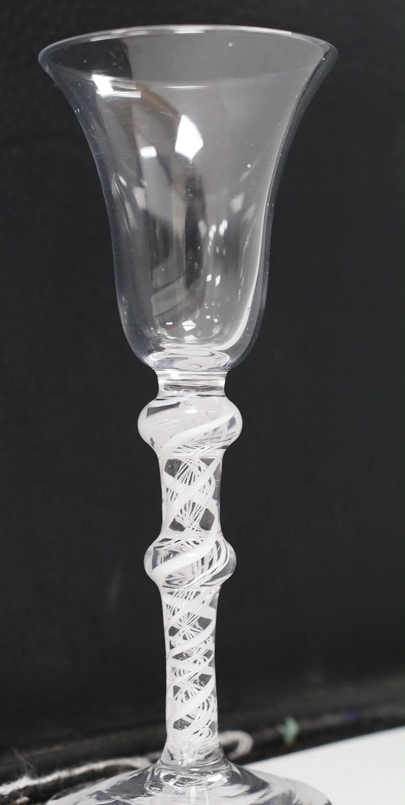 An 18th century double knopped opaque twist stem wine glass. 16.5cm high